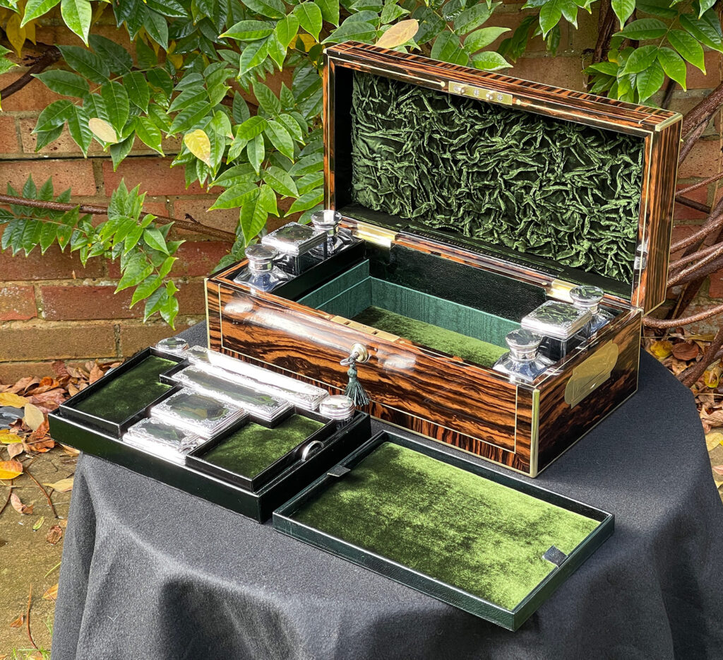 Front right internal view of an Antique Silver Mounted Dressing Case in Calamander, by Thomas Strudwick with all trays removed.