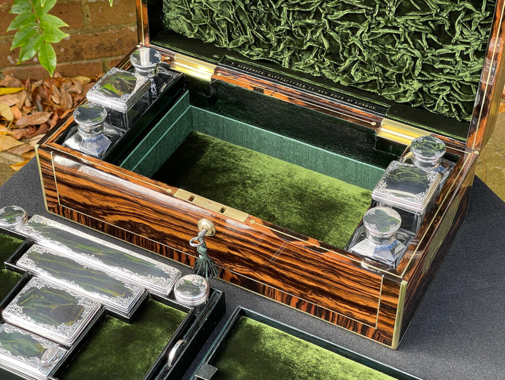 Closer view of the interior base section from an Antique Silver Mounted Dressing Case in Calamander, by Thomas Strudwick.