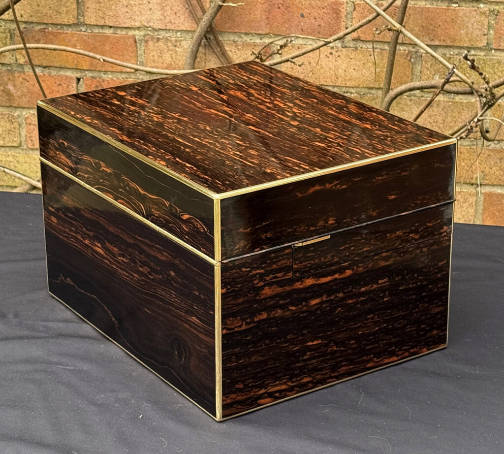 Rear left view of an Antique Jewellery Box in Coromandel with Betjemann Patent Automatic Mechanism.