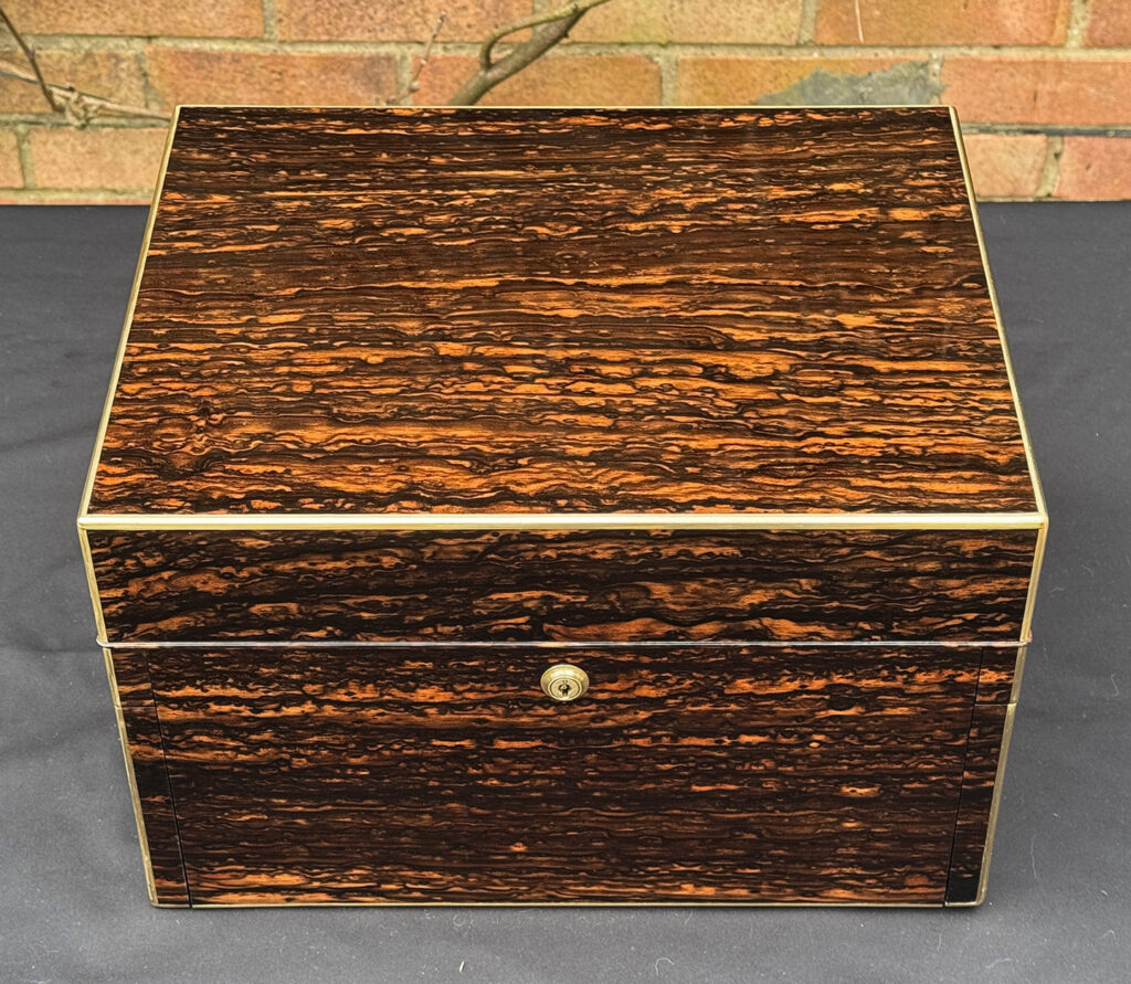 Top view of an Antique Jewellery Box in Coromandel with Betjemann Patent Automatic Mechanism.