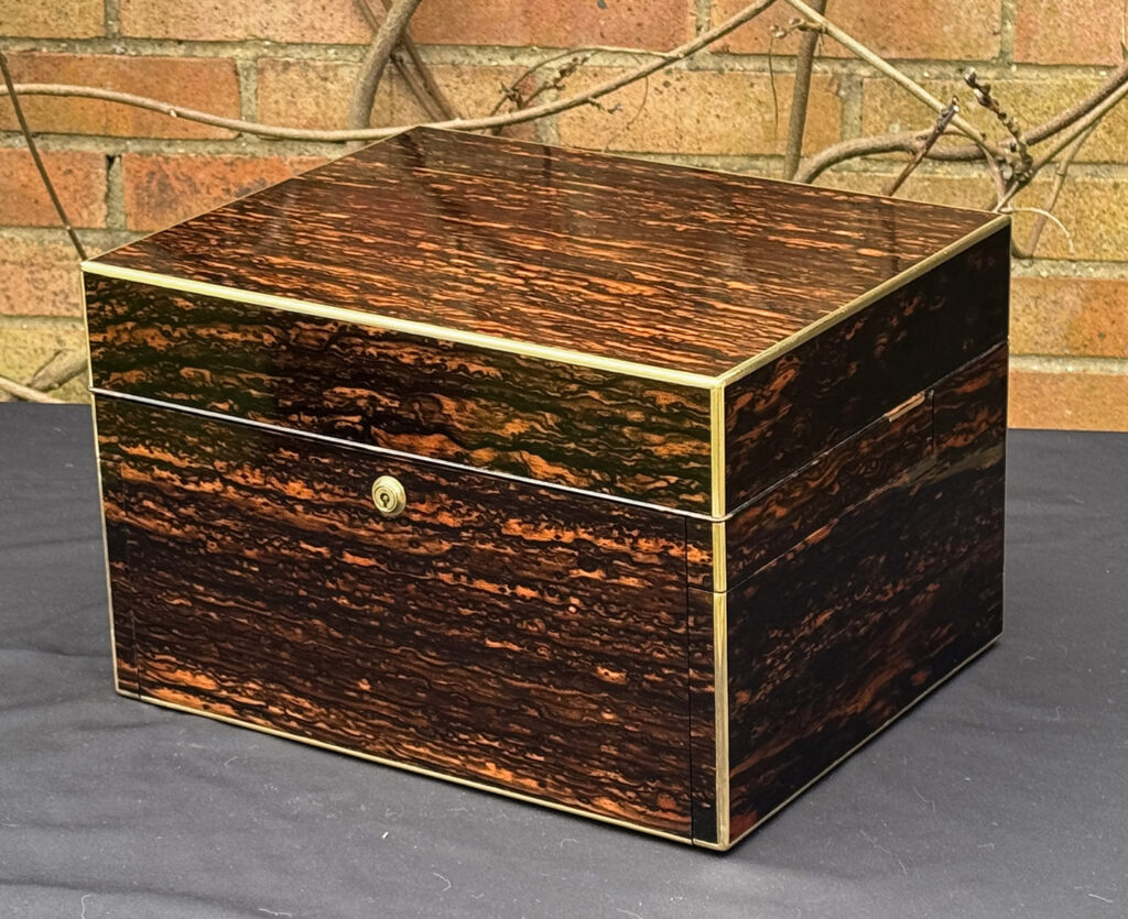 Front right view of an Antique Jewellery Box in Coromandel with Betjemann Patent Automatic Mechanism.