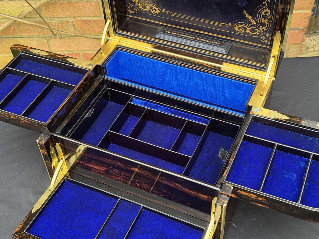 Overhead  interior view of an Antique Jewellery Box in Coromandel with Betjemann Patent Automatic Mechanism.