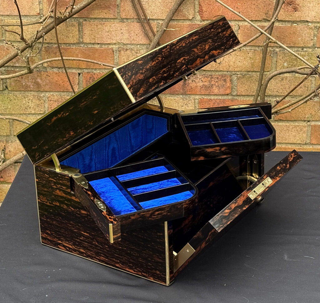 Left side further opening view of an Antique Jewellery Box in Coromandel with Betjemann Patent Automatic Mechanism.