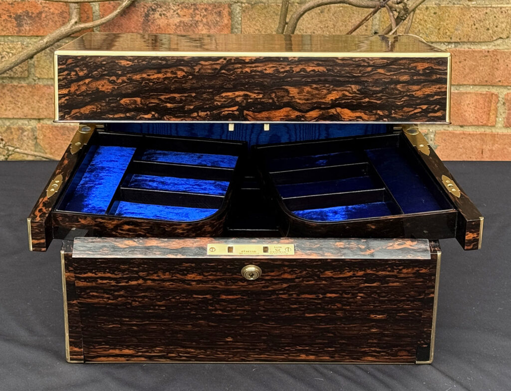 Front opening view of an Antique Jewellery Box in Coromandel with Betjemann Patent Automatic Mechanism.