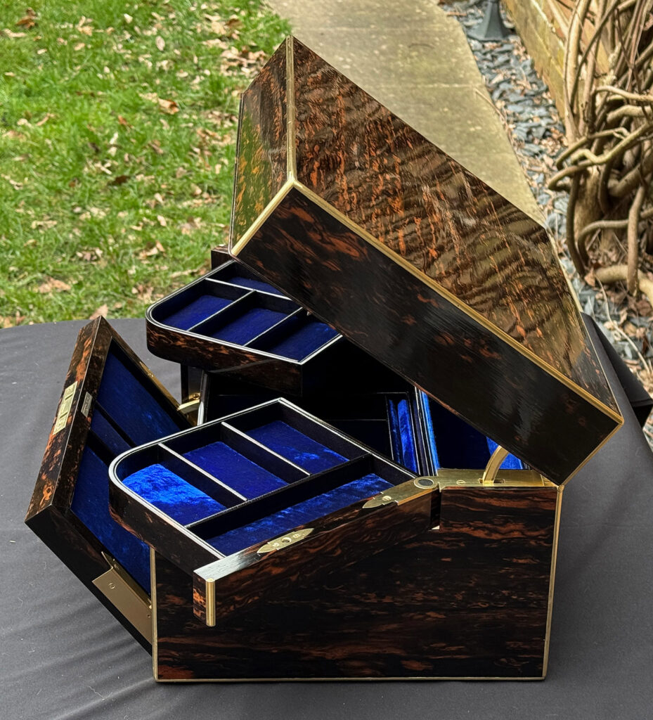 Overhead right side opening view of an Antique Jewellery Box in Coromandel with Betjemann Patent Automatic Mechanism.