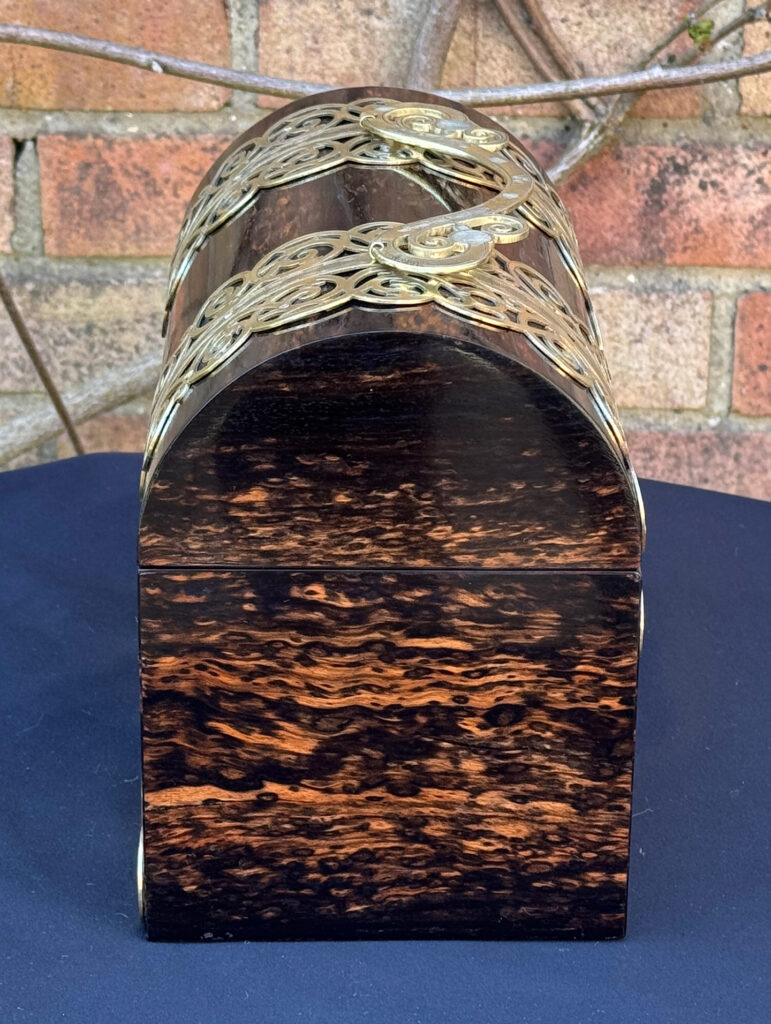 Right side view of an Antique Jewellery Box in Coromandel With Engraved Brass Overlay.