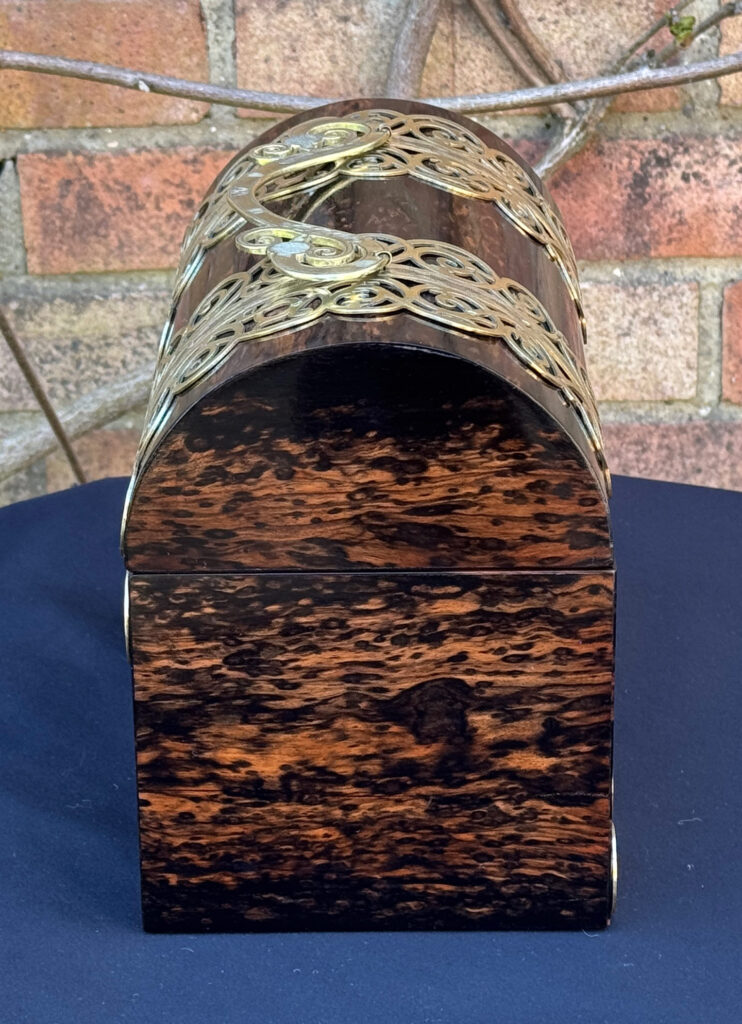 Left side view of an Antique Jewellery Box in Coromandel With Engraved Brass Overlay.