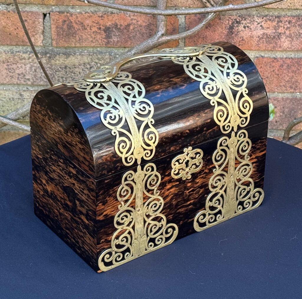 Front left view of an Antique Jewellery Box in Coromandel With Engraved Brass Overlay.