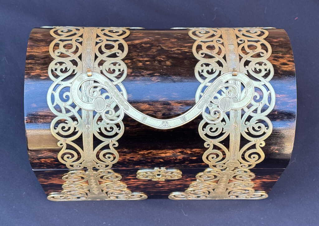 Top view of an Antique Jewellery Box in Coromandel With Engraved Brass Overlay.