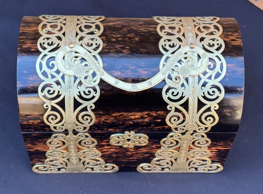 Top view of an Antique Jewellery Box in Coromandel With Engraved Brass Overlay.