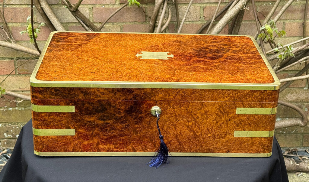 Front view of an Extra Large Antique Jewellery Box in Solid Amboyna, by Asprey.