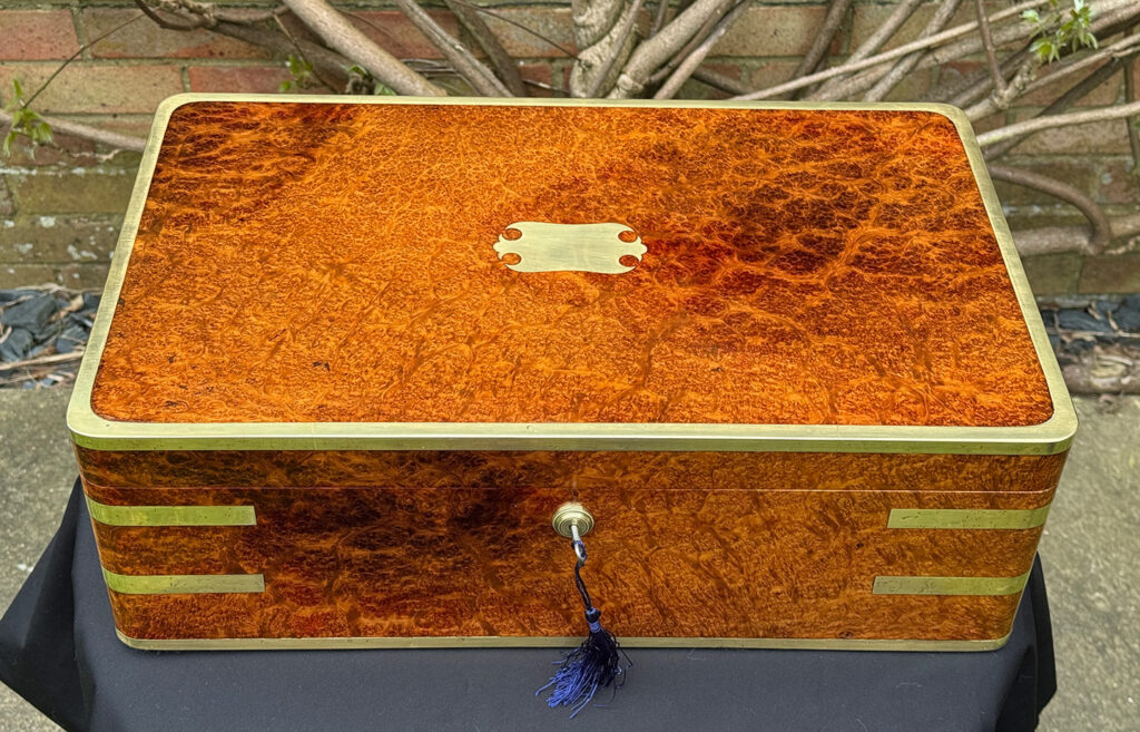Front overhead view of an Extra Large Antique Jewellery Box in Solid Amboyna, by Asprey.