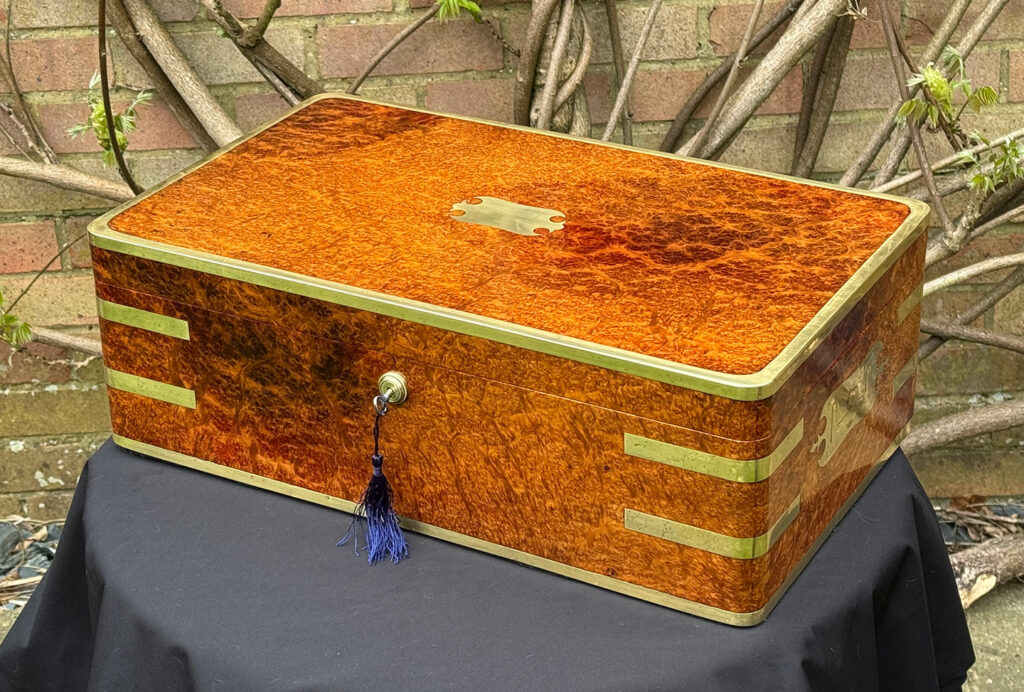 Front right view of an Extra Large Antique Jewellery Box in Solid Amboyna, by Asprey.