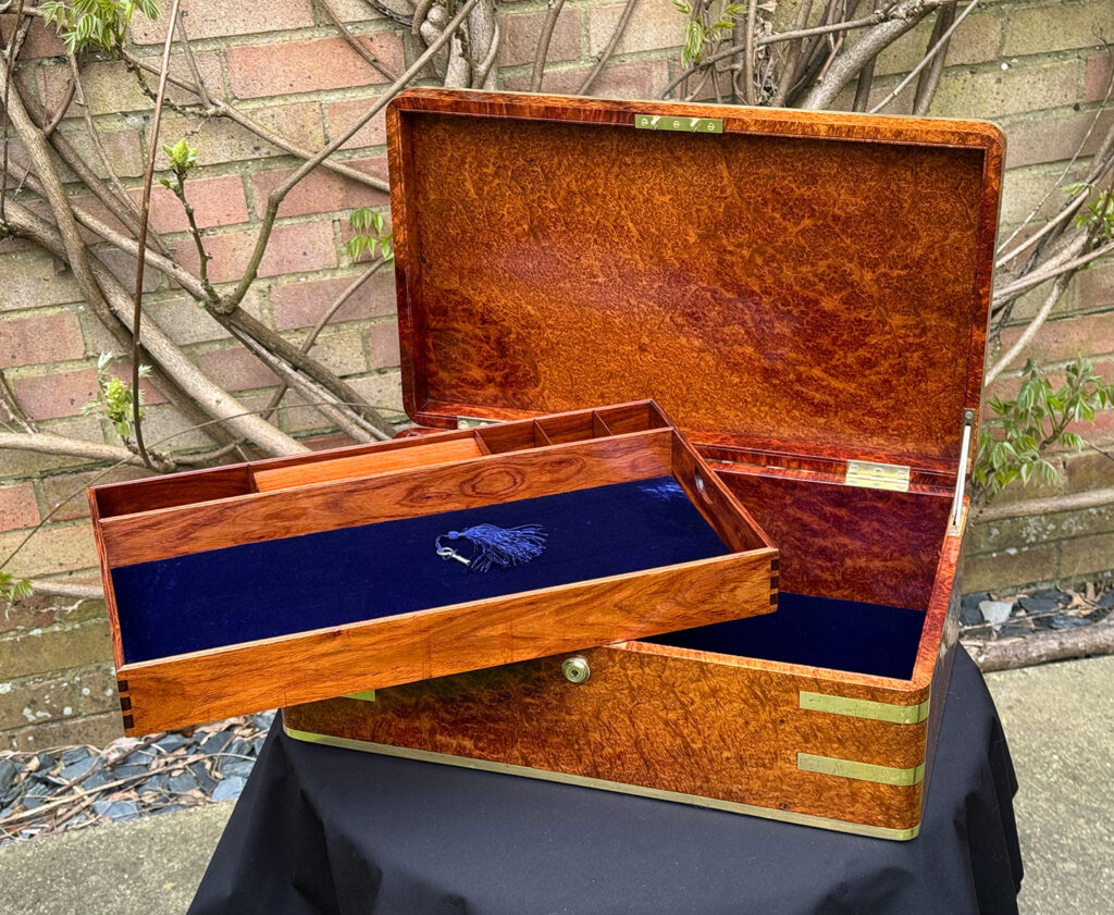 Front internal view of an Extra Large Antique Jewellery Box in Solid Amboyna, by Asprey with tray removed.