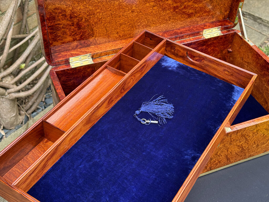 Close up of tray from an Extra Large Antique Jewellery Box in Solid Amboyna, by Asprey.