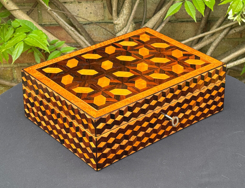 Front left view of an Antique Jewellery Box with Parquetry Inlay.