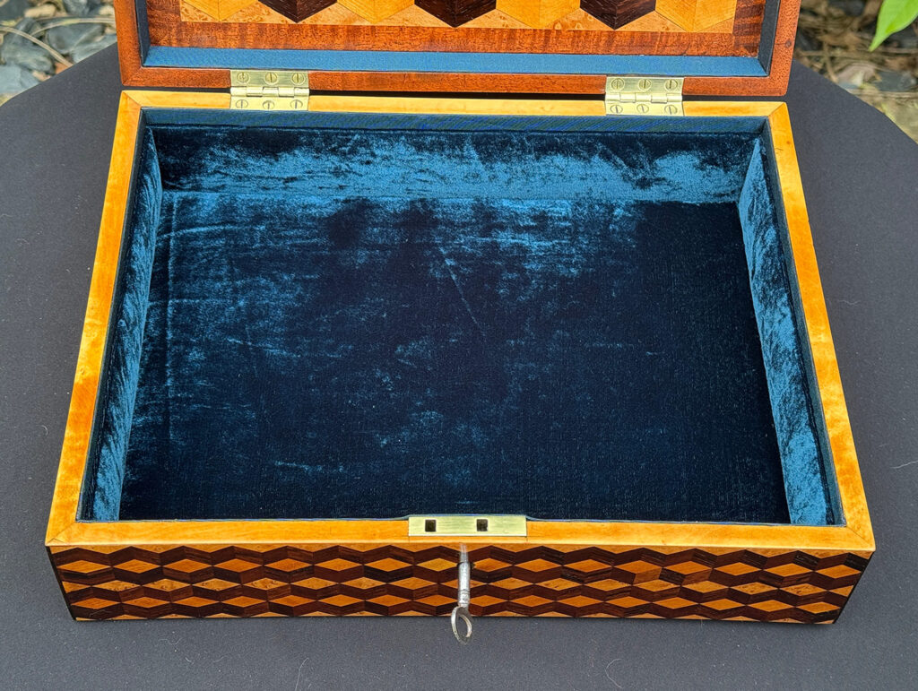 Close up internal view of an Antique Jewellery Box with Parquetry Inlay.