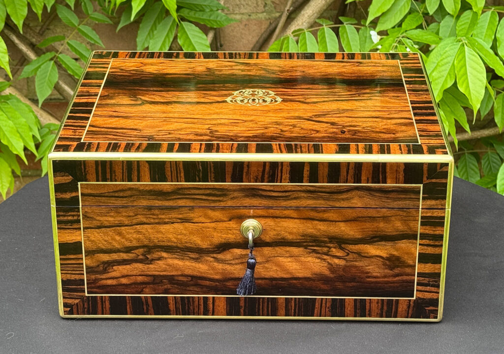 Front view of an Antique Jewellery Box in Calamander, by Edwards.