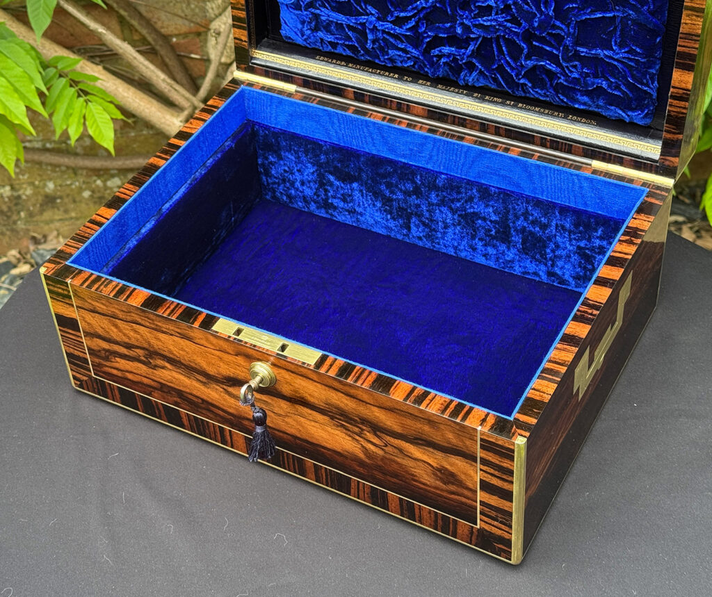 Close up internal view of an Antique Jewellery Box in Calamander, by Edwards.