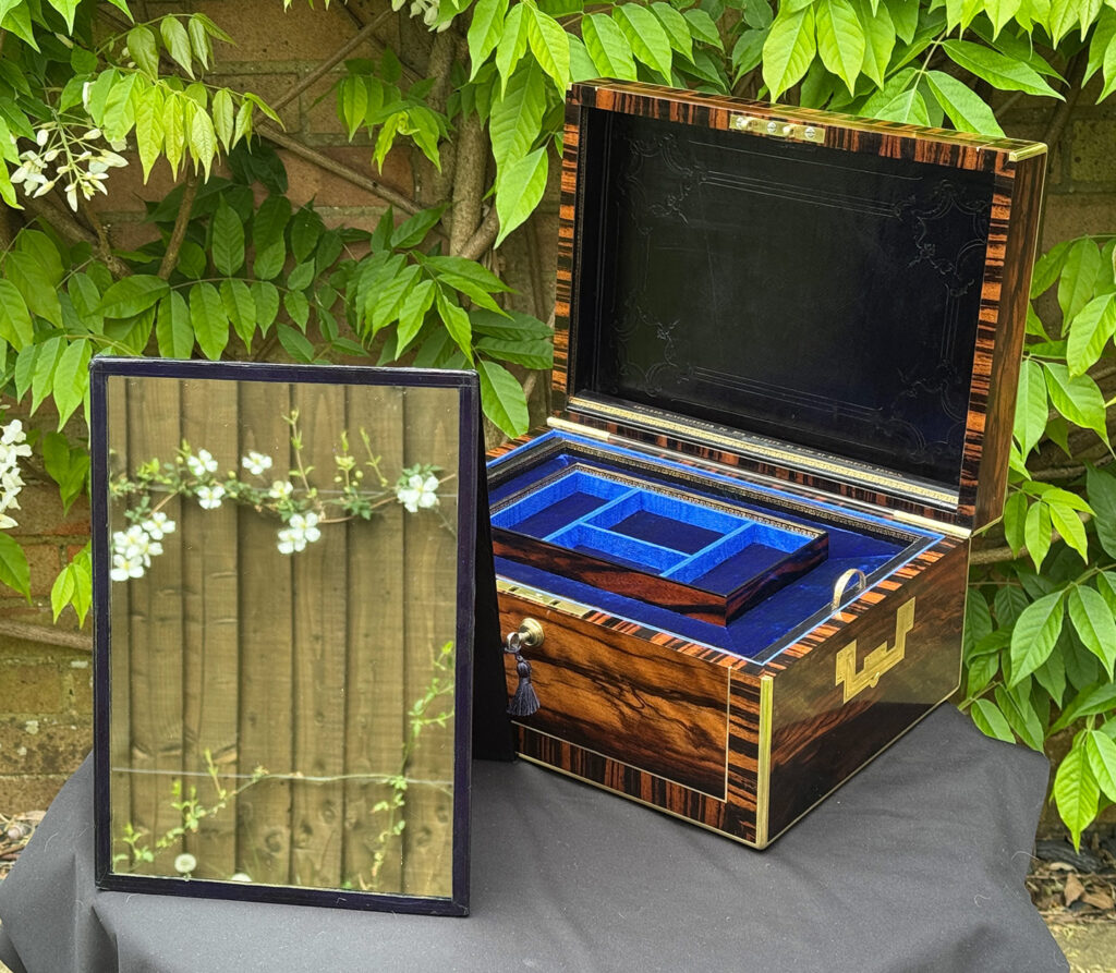 Front right internal view of an Antique Jewellery Box in Calamander, by Edwards with mirror freestanding.