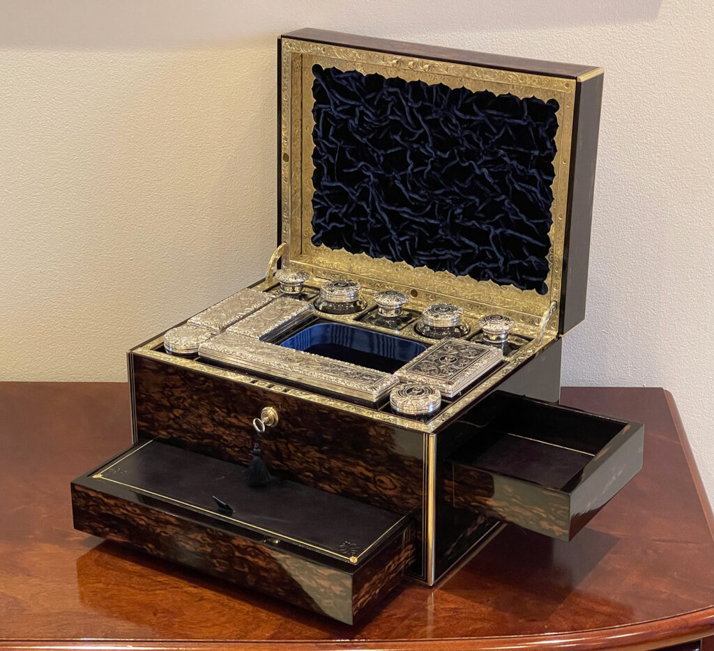 Front right open view of an Antique Silver Mounted Dressing Case in Coromandel, by William Tooke with both drawers open.