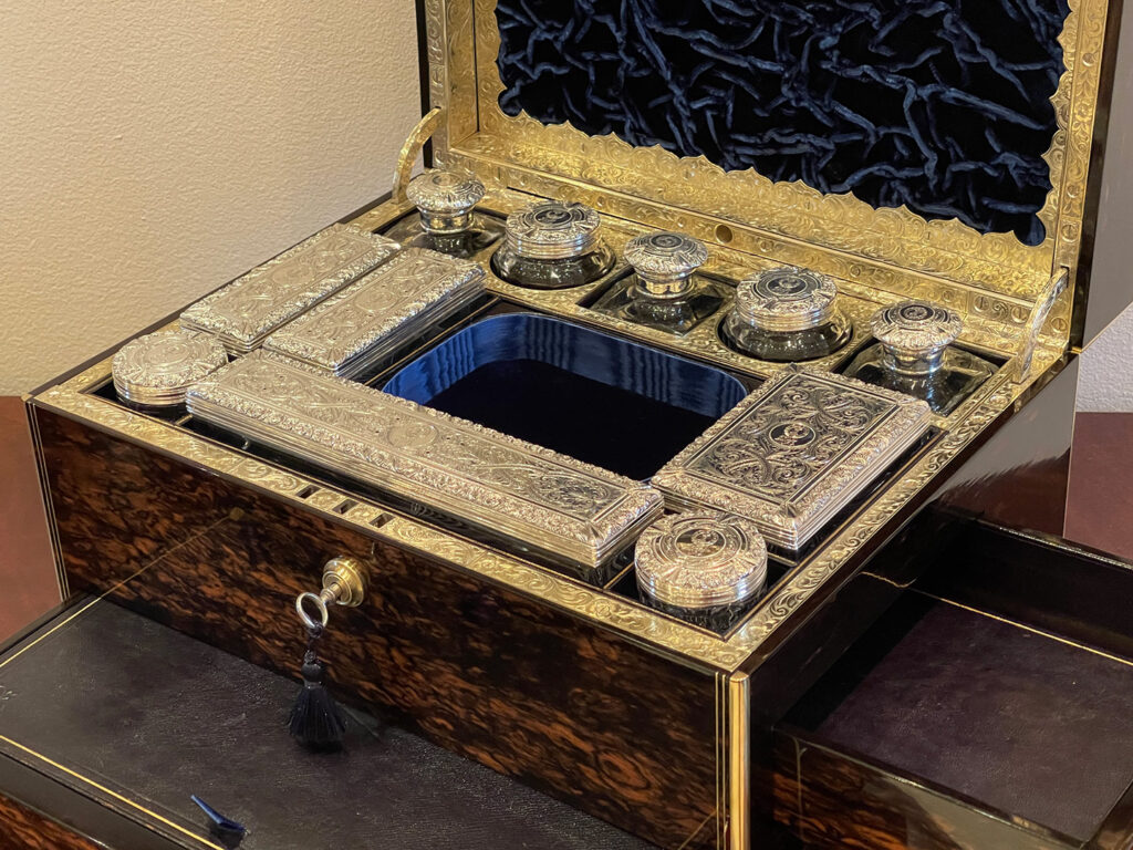 View of the silver mounted jars from an Antique Silver Mounted Dressing Case in Coromandel, by William Tooke.