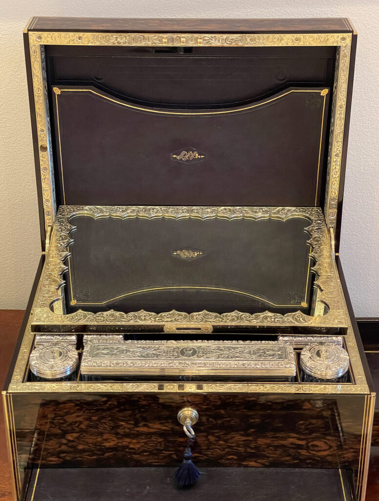 Front internal view of the makers mark in the lid from an Antique Silver Mounted Dressing Case in Coromandel, by William Tooke.