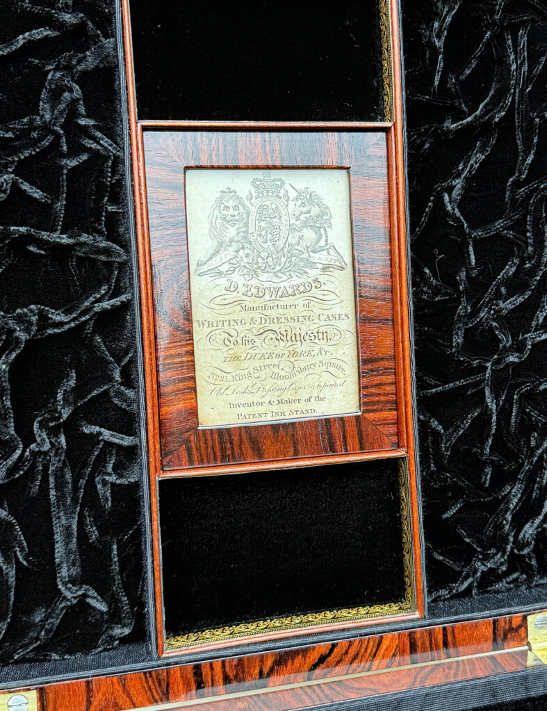 Closer angled view of the makers label from a Very Rare 1816 Edwards Retail Presentation Kingwood Jewellery Box.