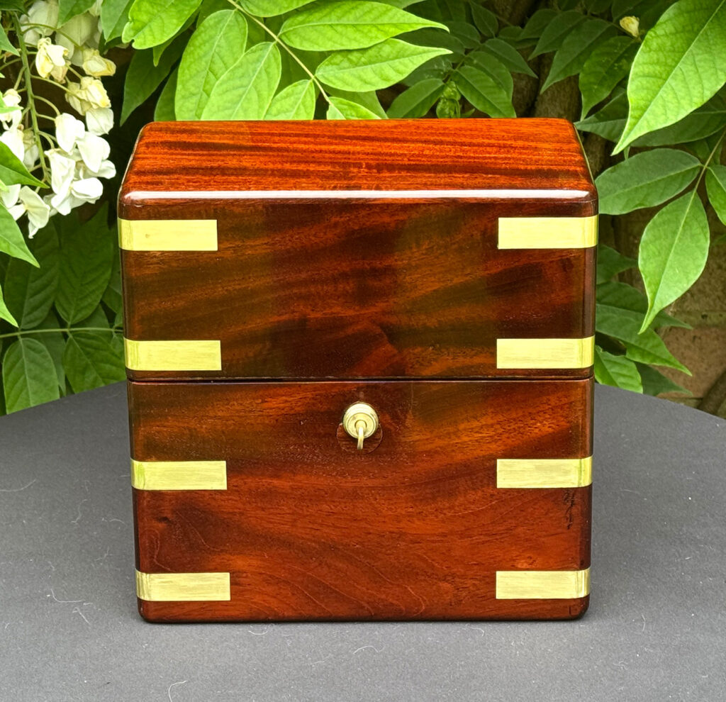 Head on view of an Antique Jewellery Strong Box in Cuban Mahogany, by Leuchars.