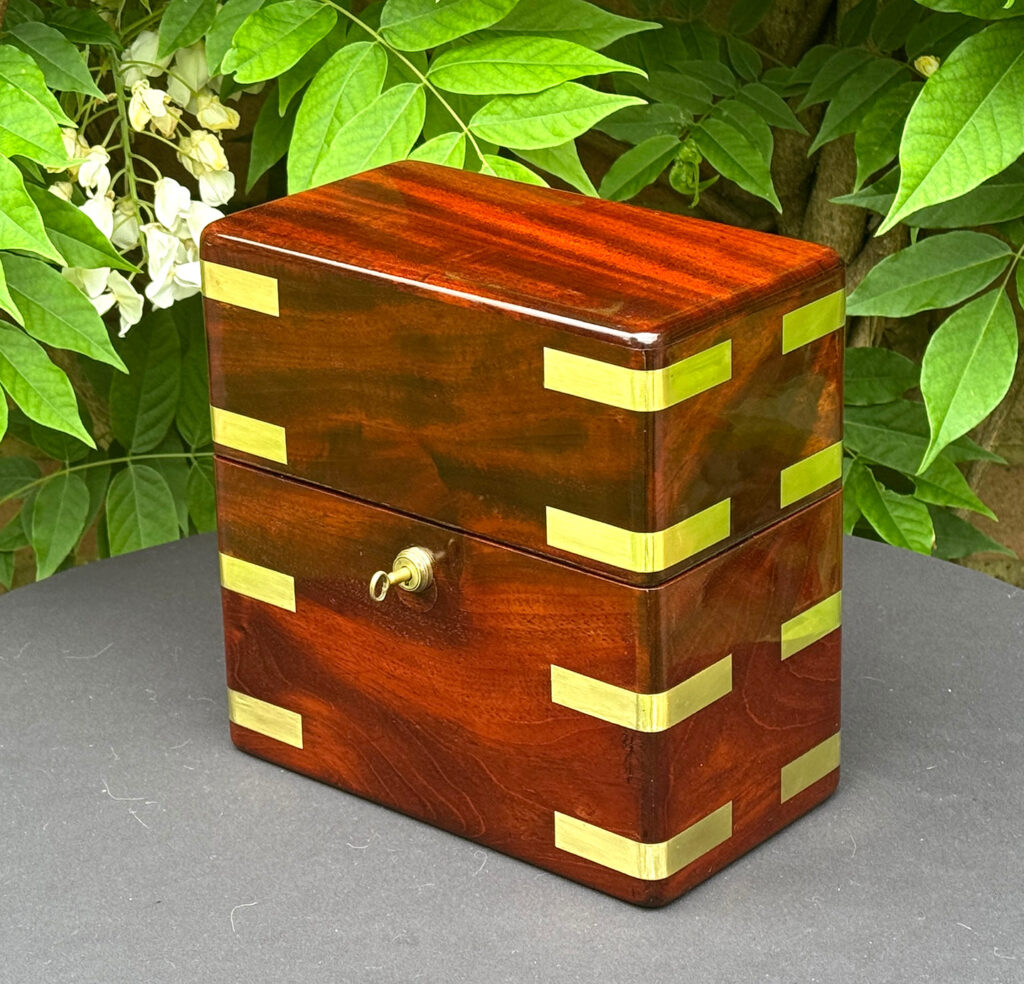 Front right view of an Antique Jewellery Strong Box in Cuban Mahogany, by Leuchars.