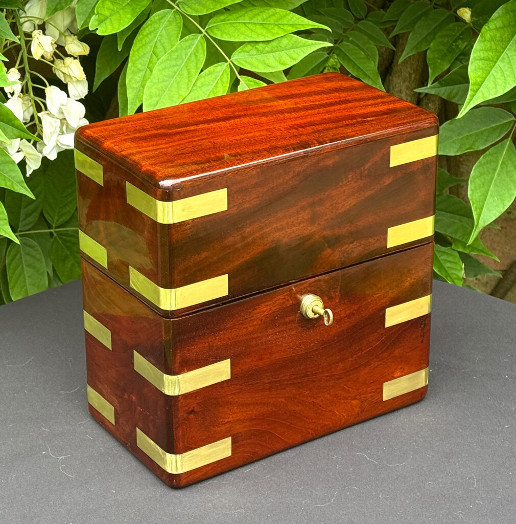 Front left view of an Antique Jewellery Strong Box in Cuban Mahogany, by Leuchars.
