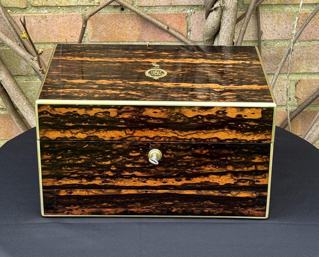 Front view of an Antique Jewellery Box in Coromandel, by Halstaff and Hannaford.