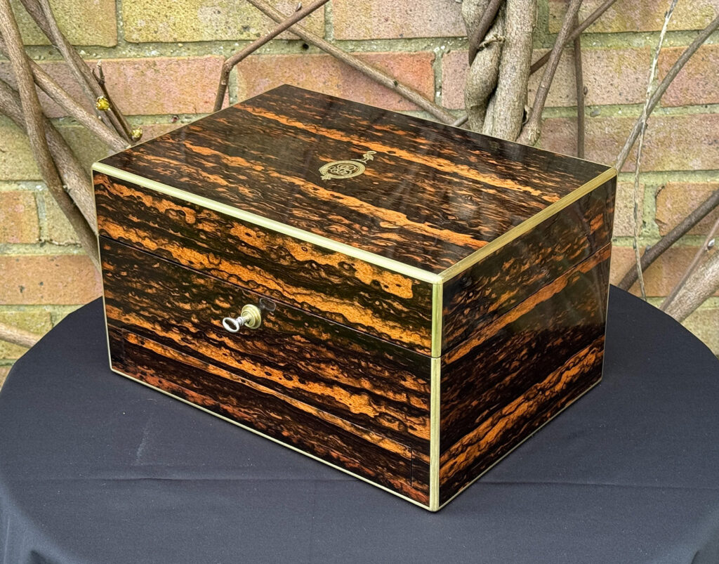 Front right view of an Antique Jewellery Box in Coromandel, by Halstaff and Hannaford.