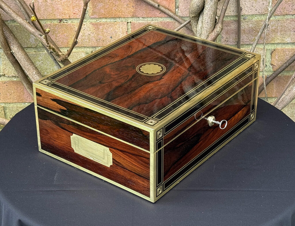 Front left view of an Antique Jewellery Box in Rosewood with Ebony and Brass Inlay.