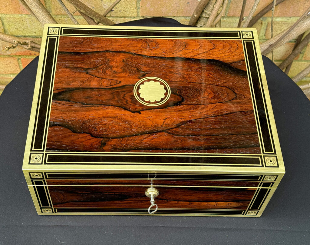 Top view of an Antique Jewellery Box in Rosewood with Ebony and Brass Inlay.