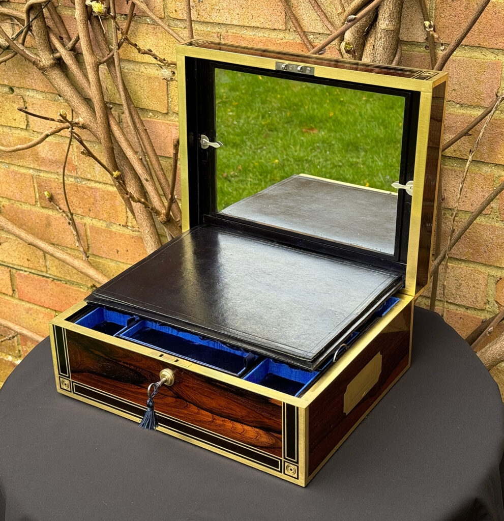 Front right internal view of an Antique Jewellery Box in Rosewood with Ebony and Brass Inlay with mirror on display.