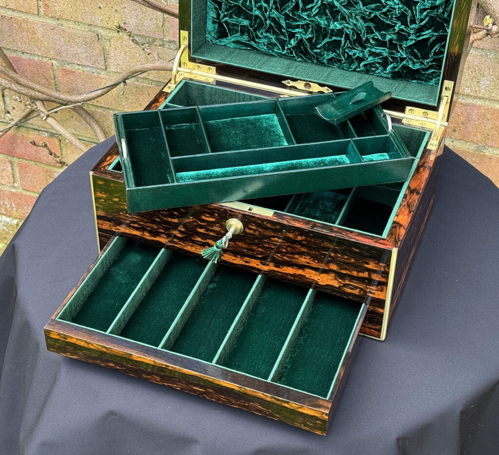 Closer internal view of an Antique Jewellery Box in Coromandel, by Halstaff and Hannaford with tray removed.