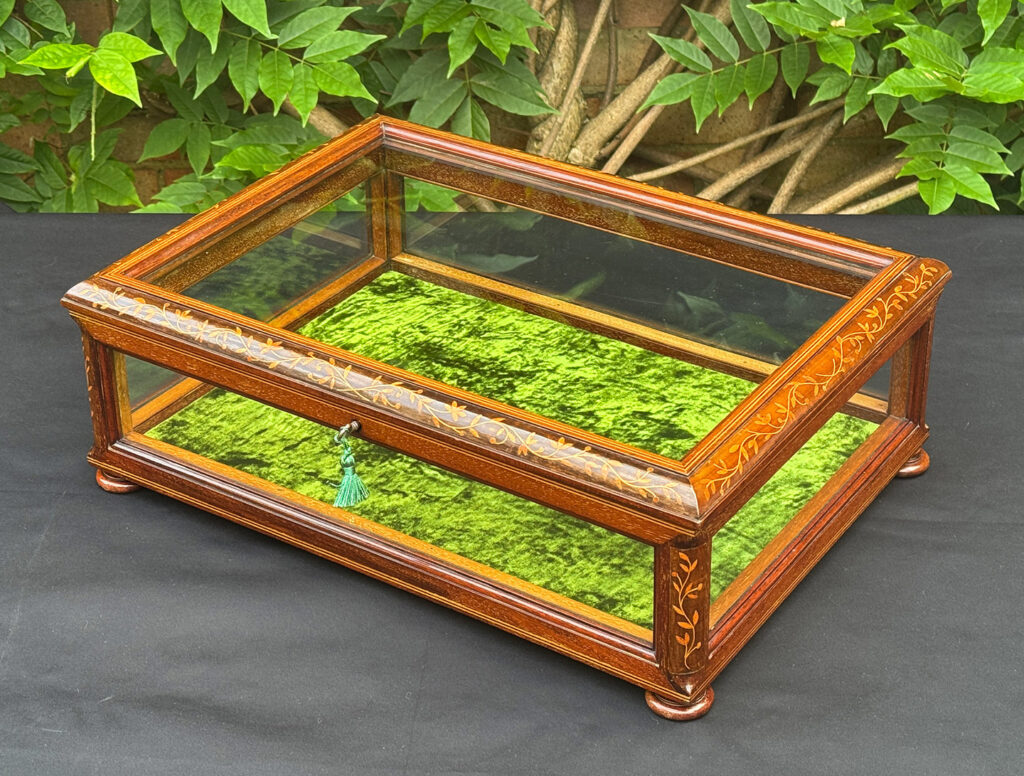 Front right view of an Antique Mahogany Glass Display Case with Foliate Marquetry Inlay.