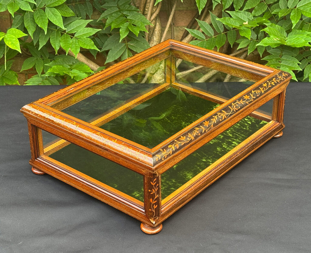 Rear right view of an Antique Mahogany Glass Display Case with Foliate Marquetry Inlay.