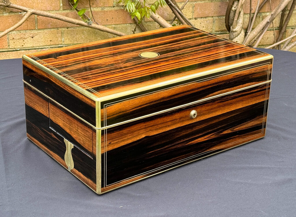 Front left side view of an Extra Large Antique Expanding Jewellery Box in Calamander.