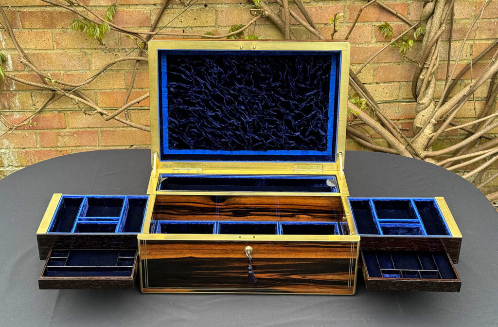 Front internal view of an Extra Large Antique Expanding Jewellery Box in Calamander with side trays and concealed drawers fully opened out.