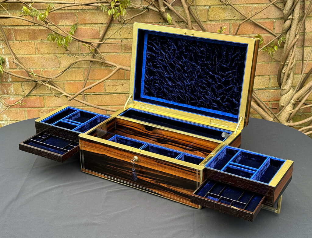 Front right open view of an Extra Large Antique Expanding Jewellery Box in Calamander with side trays and concealed drawers fully opened out.