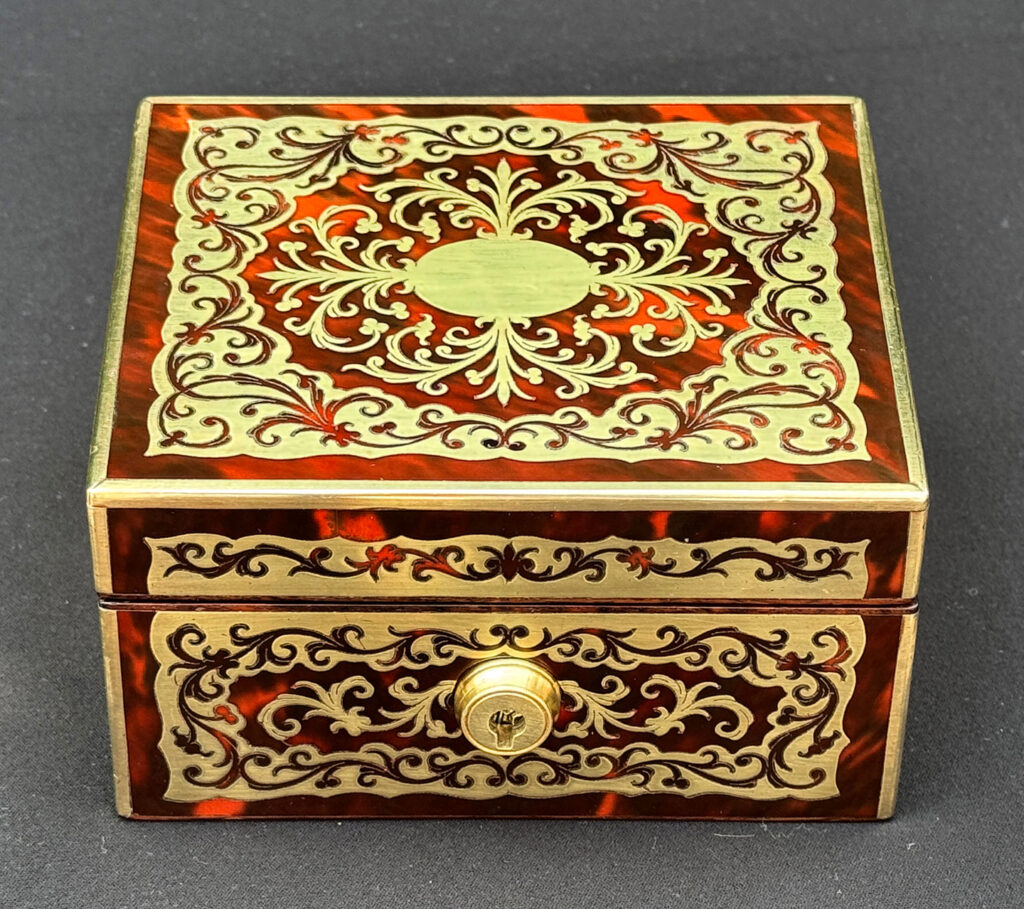 Front view of an Antique Miniature Boulle Jewellery Box with Bramah Lock.