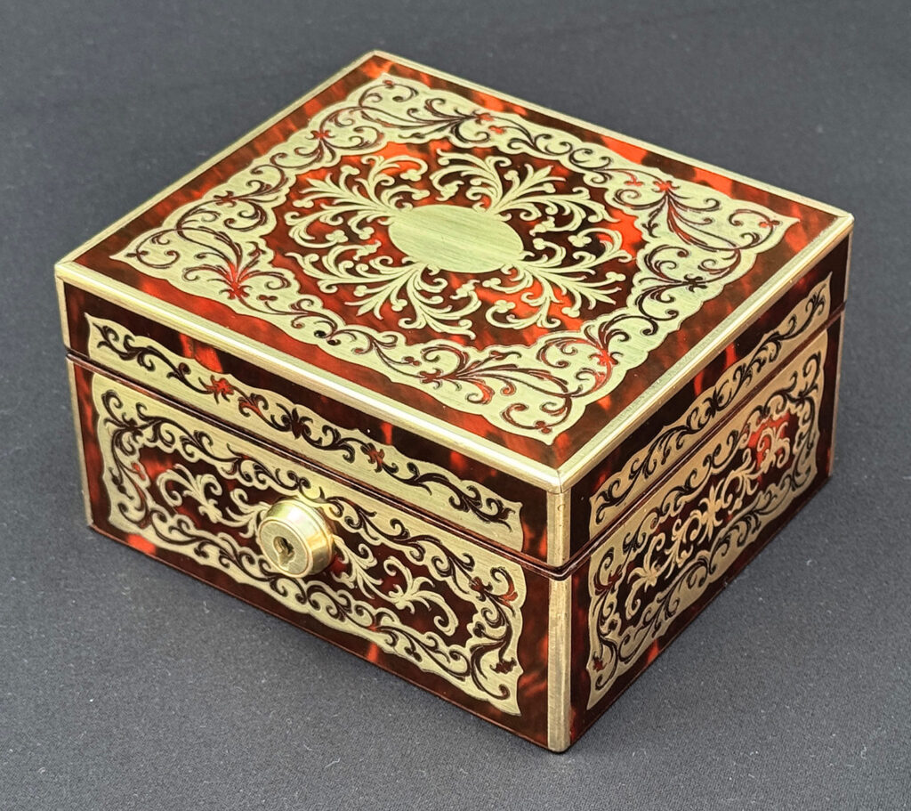 Front right view of an Antique Miniature Boulle Jewellery Box with Bramah Lock.