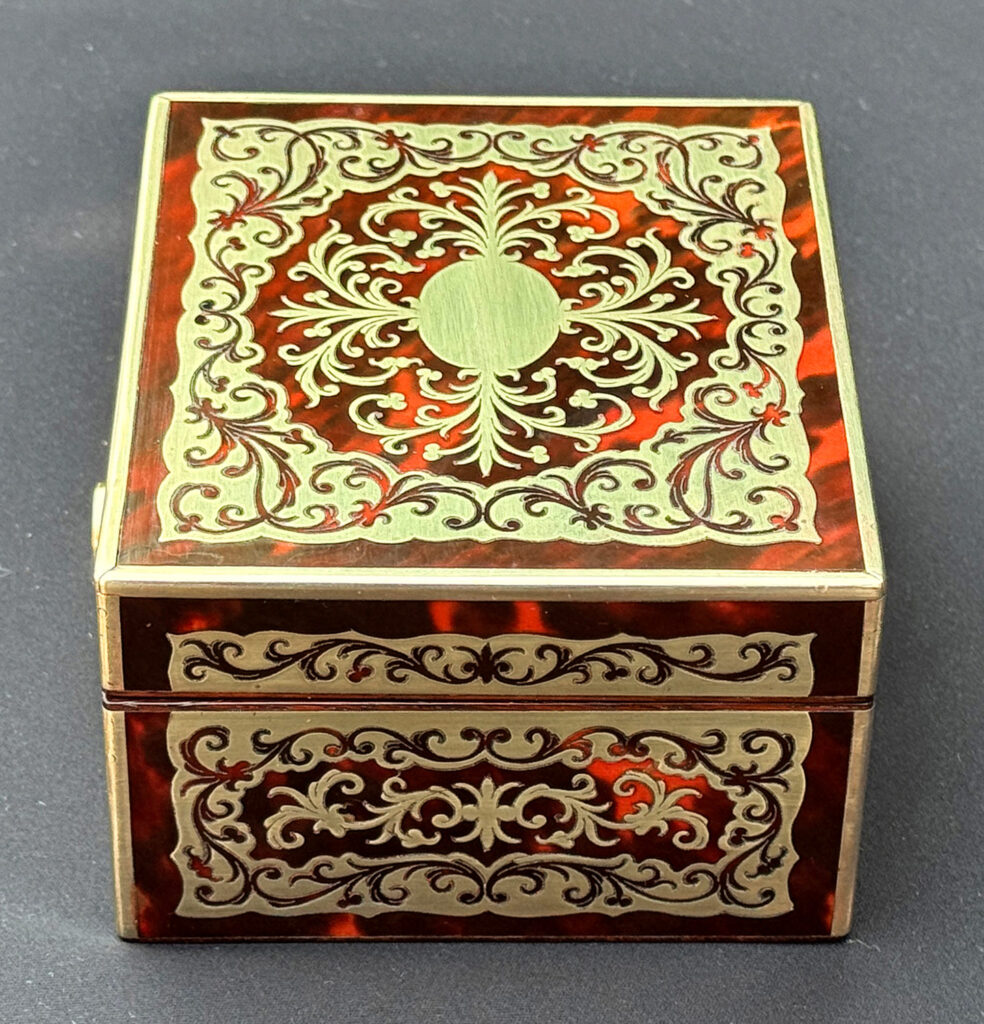 Left overhead view of an Antique Miniature Boulle Jewellery Box with Bramah Lock.