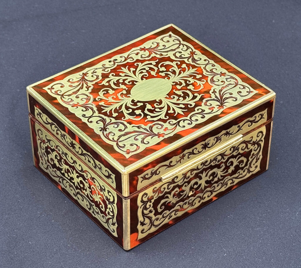 Rear right overhead view of an Antique Miniature Boulle Jewellery Box with Bramah Lock.