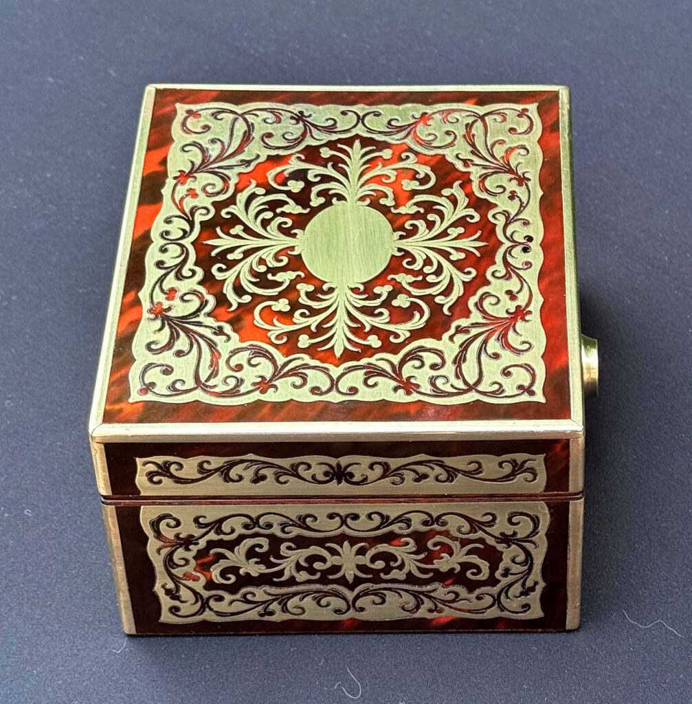 Left side overhead view of an Antique Miniature Boulle Jewellery Box with Bramah Lock.