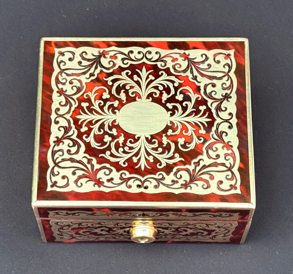 Overhead view of an Antique Miniature Boulle Jewellery Box with Bramah Lock.