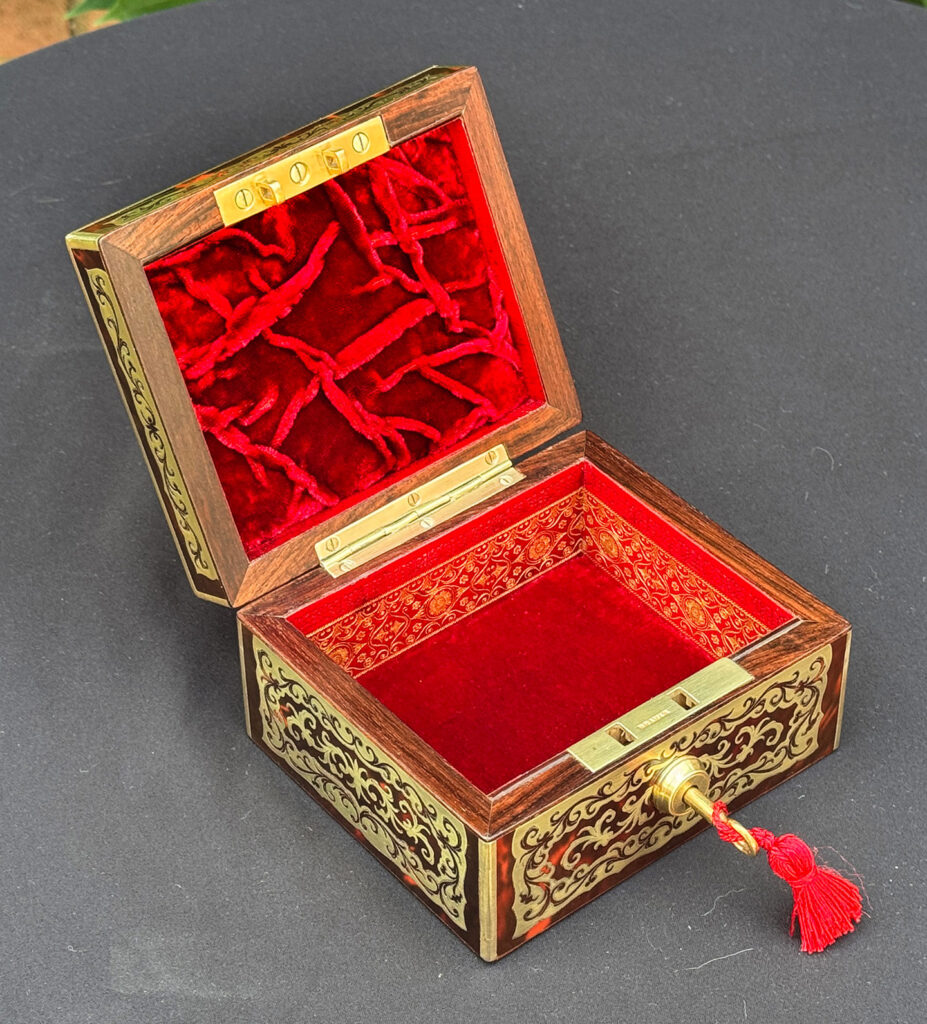 Left internal view of an Antique Miniature Boulle Jewellery Box with Bramah Lock.