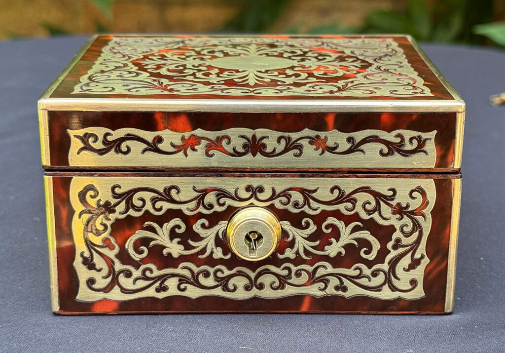 Front view of an Antique Miniature Boulle Jewellery Box with Bramah Lock.